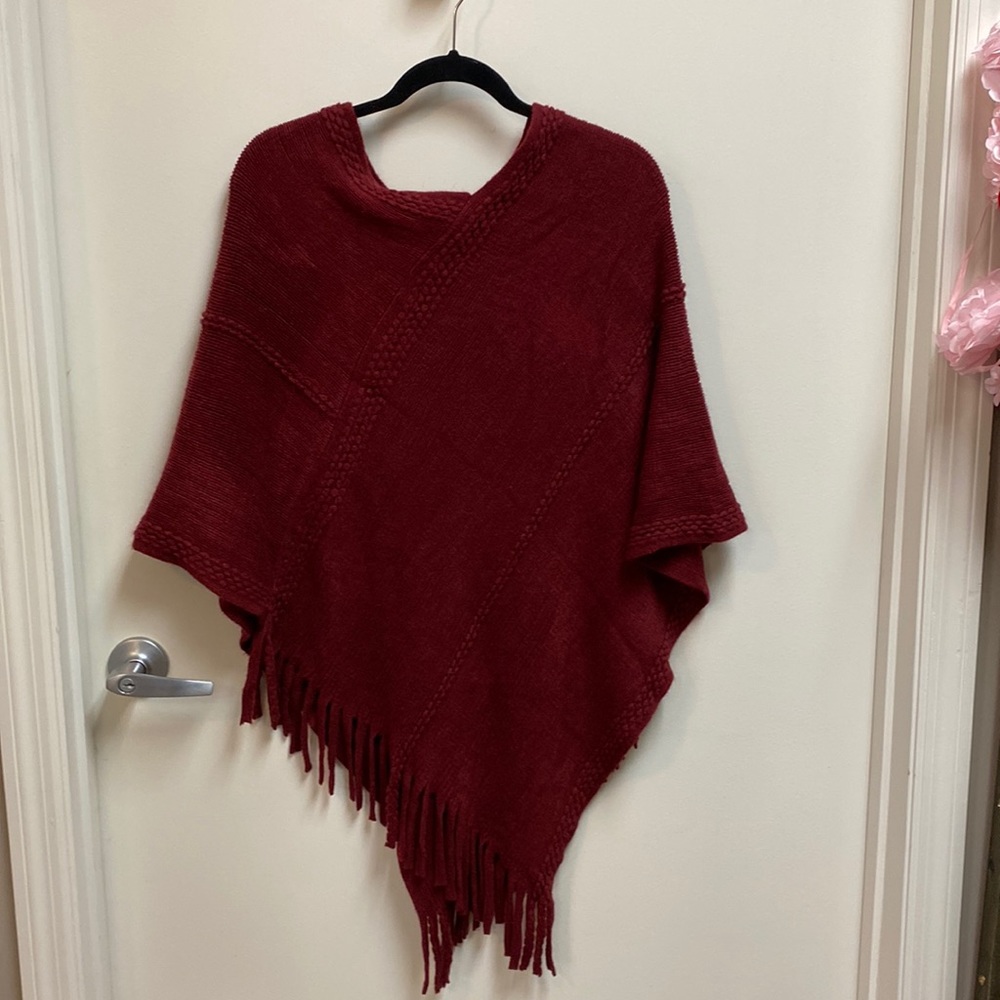 Pull on burgundy cap with large fringed bottoms made by Styline.